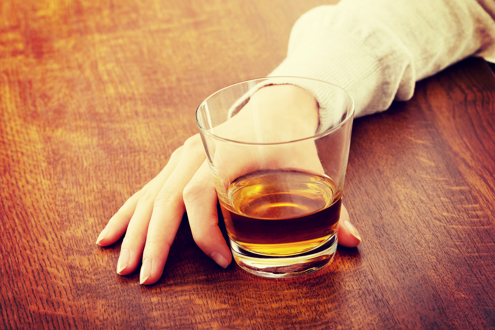 Yound beautiful woman in depression, drinking alcohol