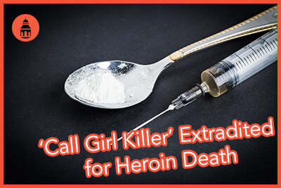 Drug syringe and cooked heroin on spoon