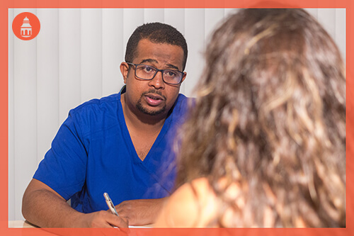 man assisting a person with medical withdrawal and detox