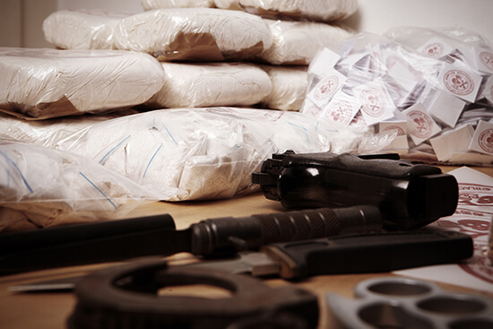 drugs seized by police with money and weapons