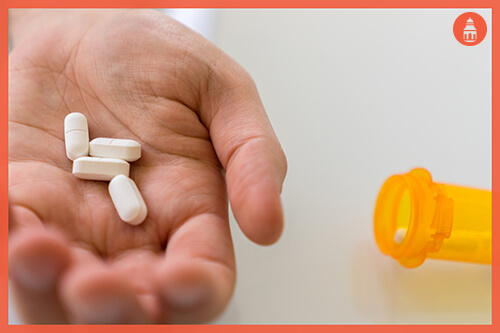 gabapentin pills in a man's hand