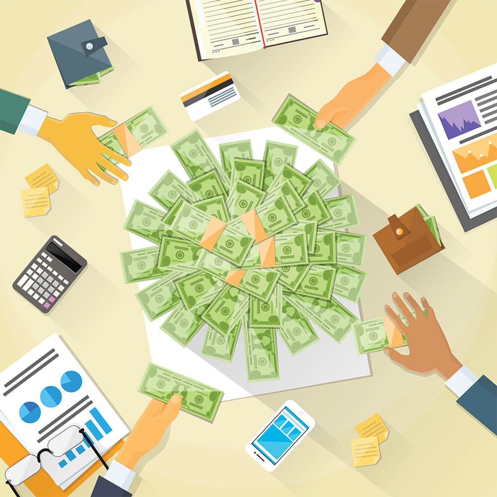 hands grabbing for money on a desk