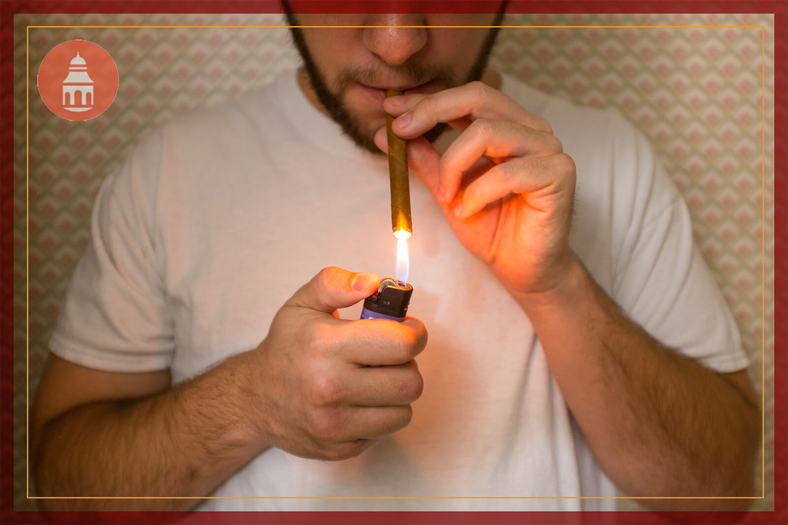 Man looking down and lighting a blunt with marijuana
