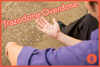 man looking down at pills in hand close up, outside