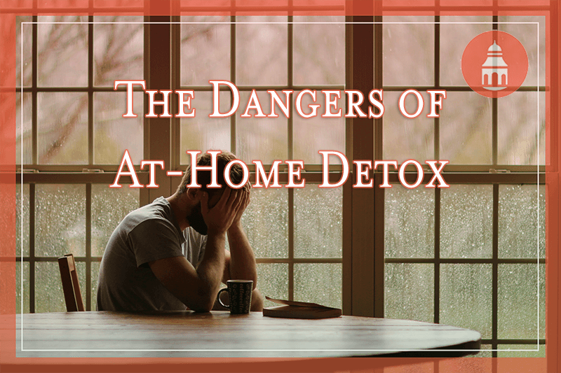 Man at home looking distressed with hands on head