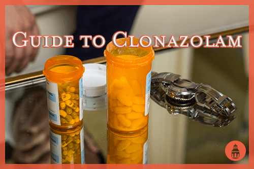 bottles of clonazolam sitting on a table next to a watch