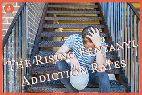 man addicted to fentanyl sitting on steps