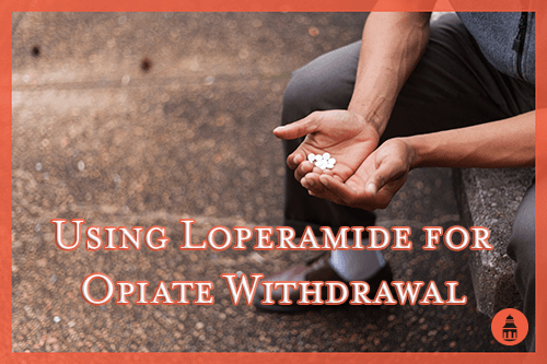 man holding loperamide pills while going through opiate withdrawal