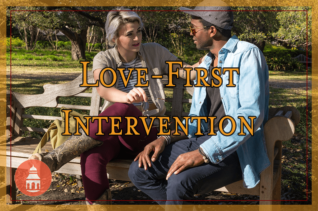 a couple sitting on bench outside talking